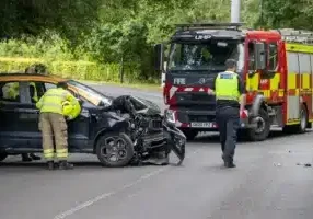 police and fire service attending road traffic accident